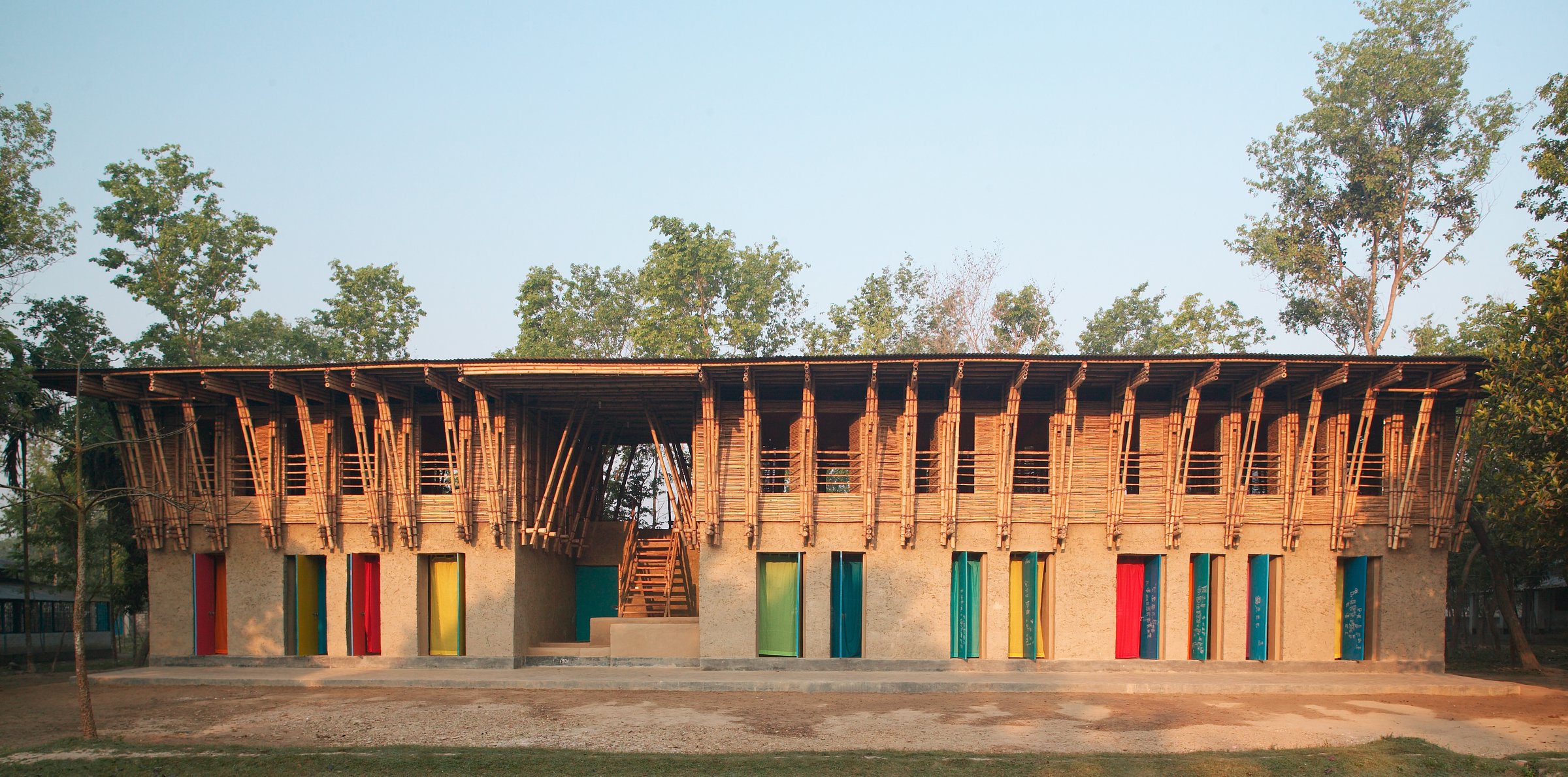 The METI School in Bangladesh used mud for walls and employed local people and craft throughout the project.
